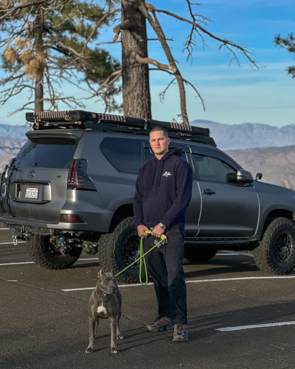Gleb with his dog Kira and off-road vehicle in San Diego